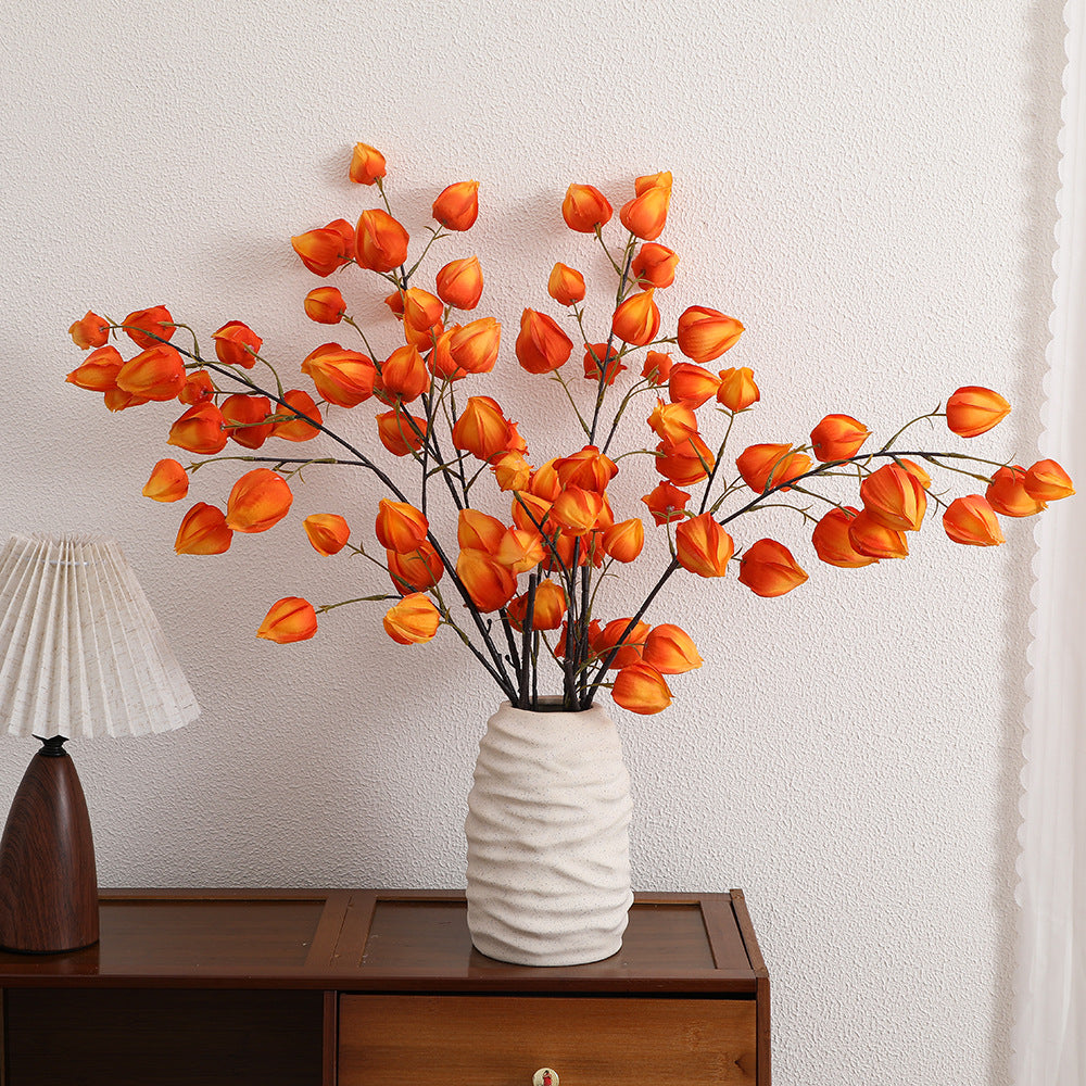 Artificial flower branch with vibrant flowers