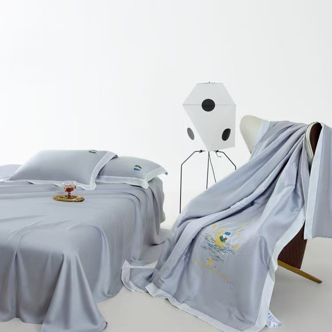 Satin bedding set with illustrative portrait embroidery and fine satin trim