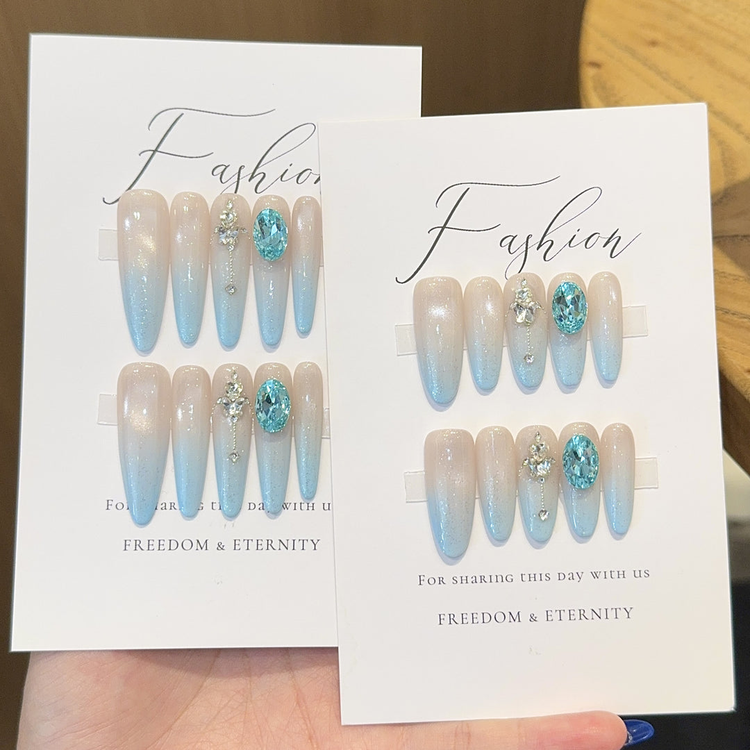Glamorous artificial nails with sparkling rhinestone details Stornfield