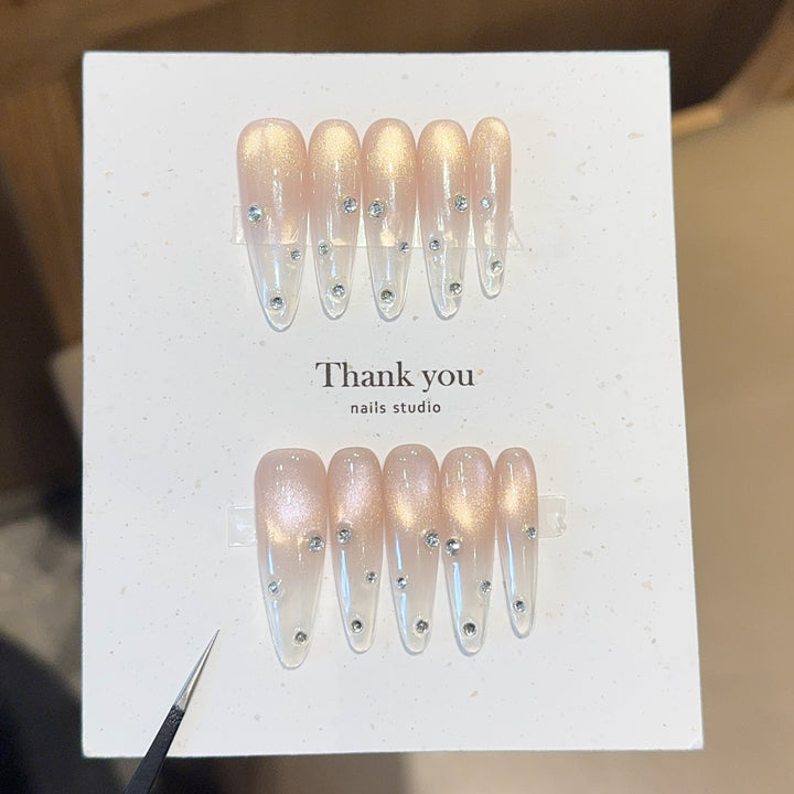 Artificial nails with shimmering accents and elegant rhinestone details Stornfield