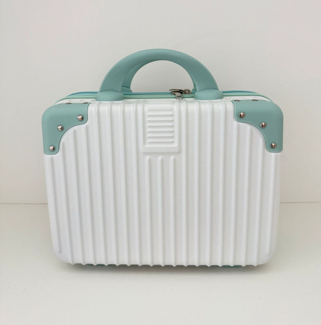 compact hard-shell travel vanity cosmetic and tech organizer with ribbed shell reinforced corners removable padded insert Stornfield