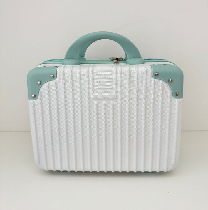 compact hard-shell travel vanity cosmetic and tech organizer with ribbed shell reinforced corners removable padded insert Stornfield