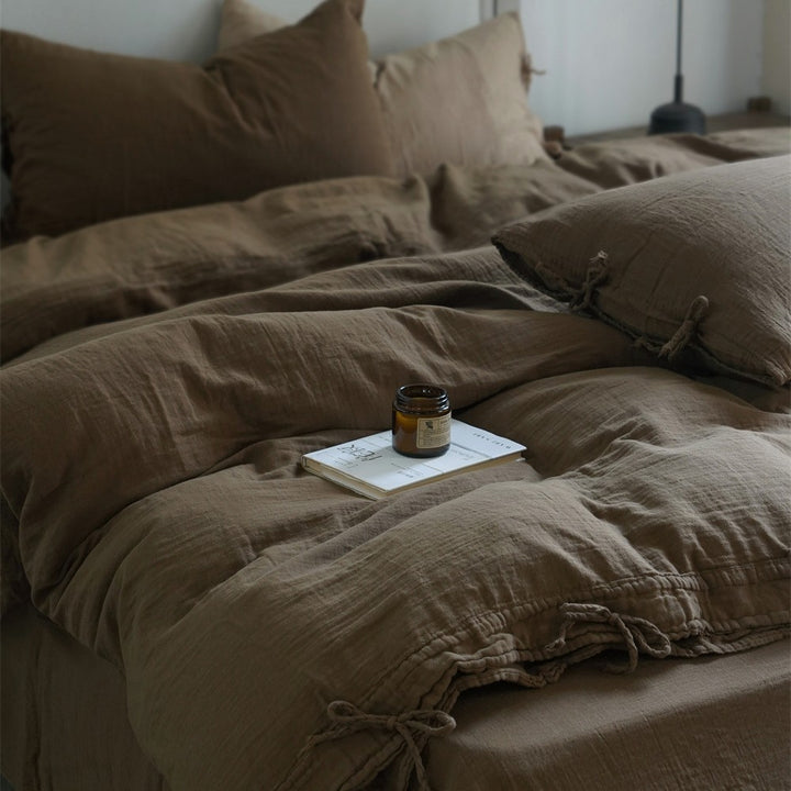 Natural linen bedding set with decorative ties and stonewashed texture