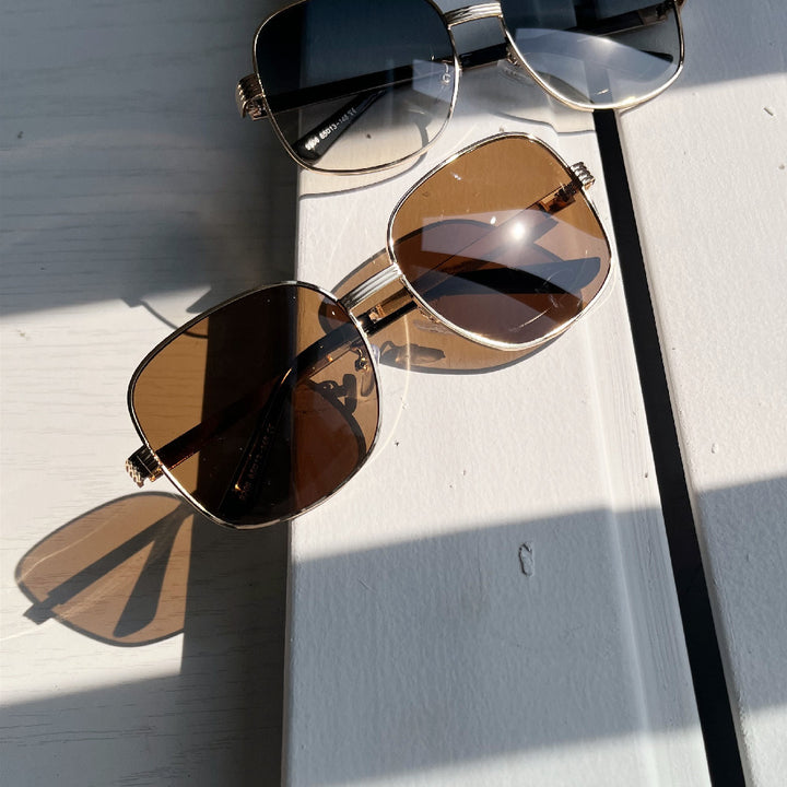 Ladies fashionable angular sunglasses with luxurious golden frame Stornfield