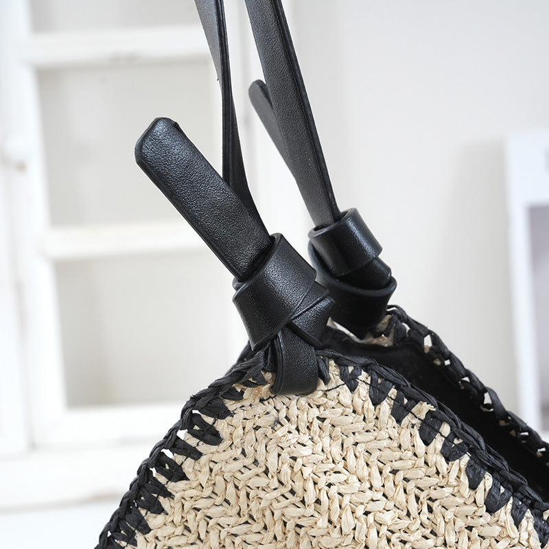 Handbag made of braided natural material with contrasting leather handles Stornfield