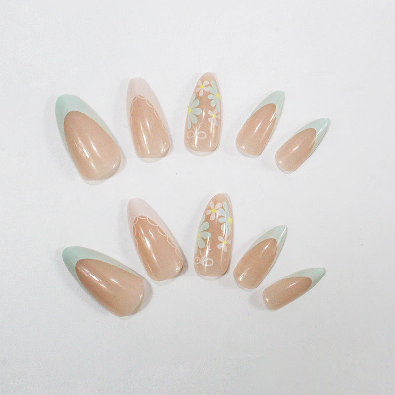 Acrylic nail set with floral accents and elegant tips Stornfield