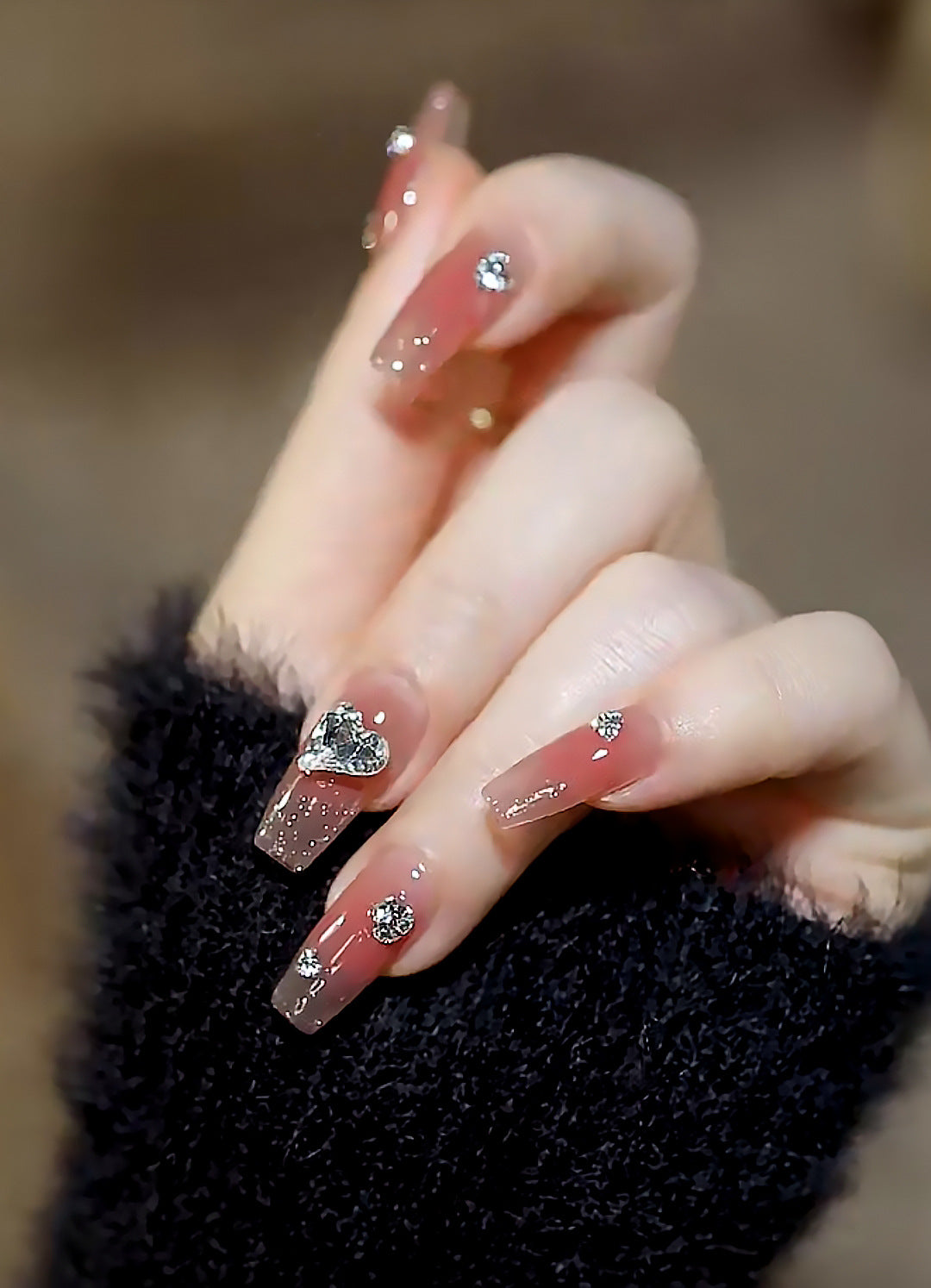 Acrylic nail set with elegant heart and rhinestone decorations Stornfield