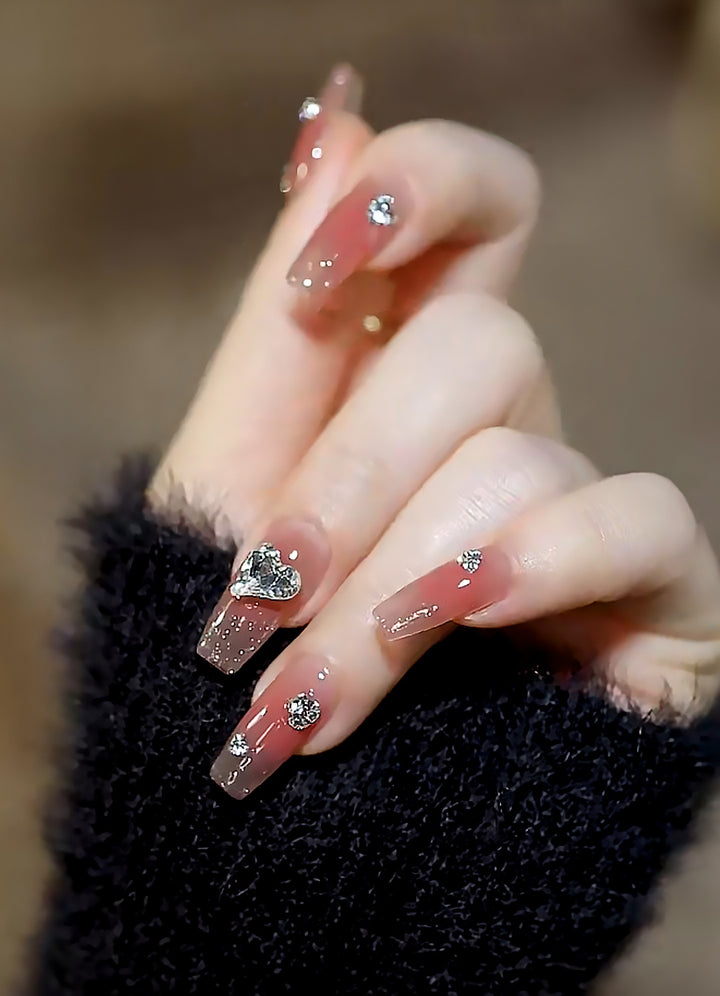 Acrylic nail set with elegant heart and rhinestone decorations Stornfield
