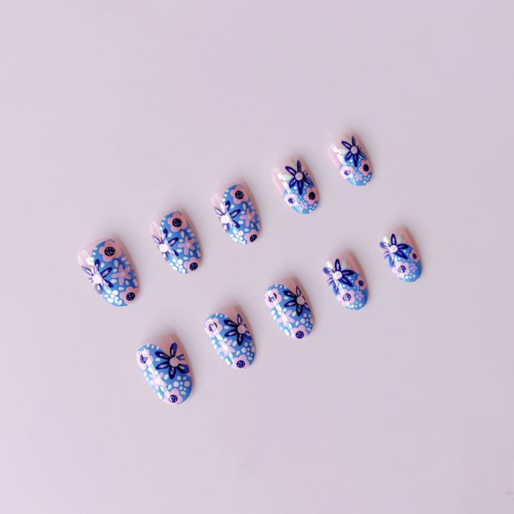 Nail art set with floral accents and vibrant patterns Stornfield