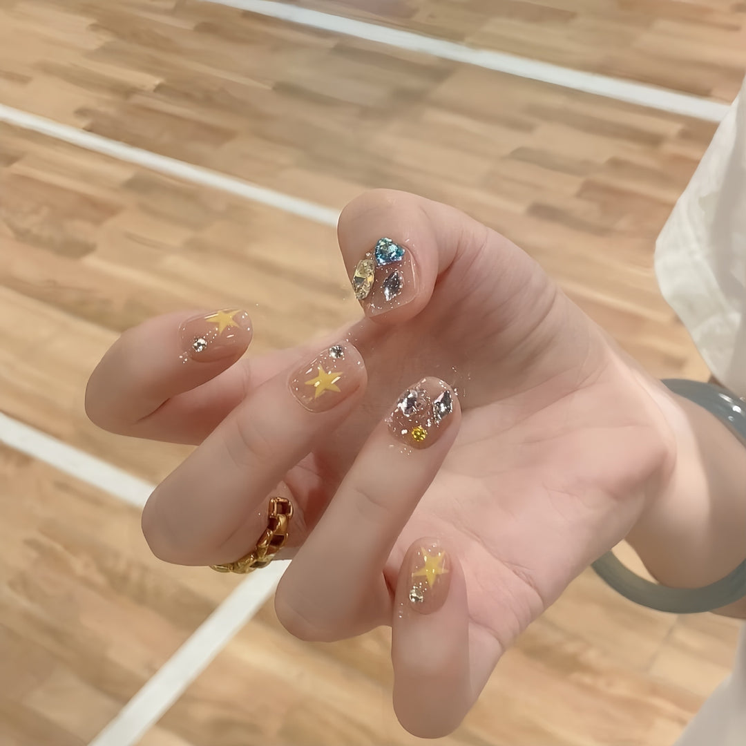 Glittering nail tips with elegant jewelry accents Stornfield