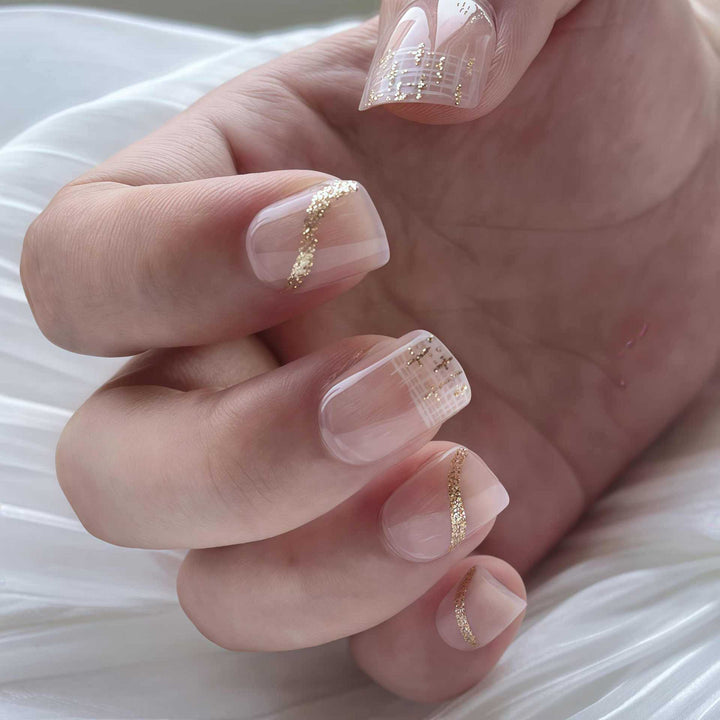 Elegant Press-On Nail Set with Gold Accent and Glitter Design Stornfield