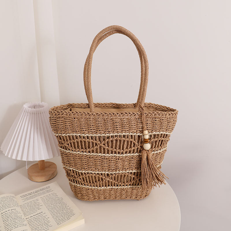 Handcrafted straw tote bag with decorative tassel detail Stornfield