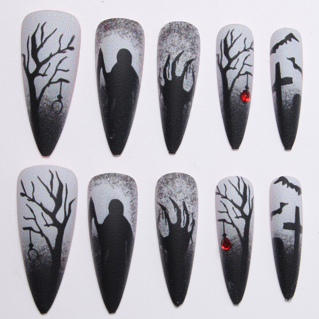 Creative press-on nails with a dark Halloween design Stornfield