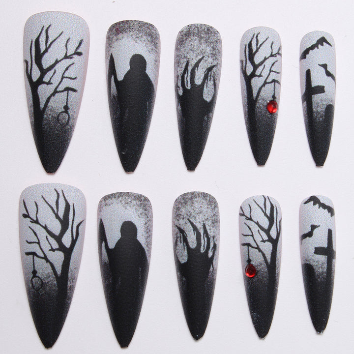 Creative press-on nails with a dark Halloween design Stornfield