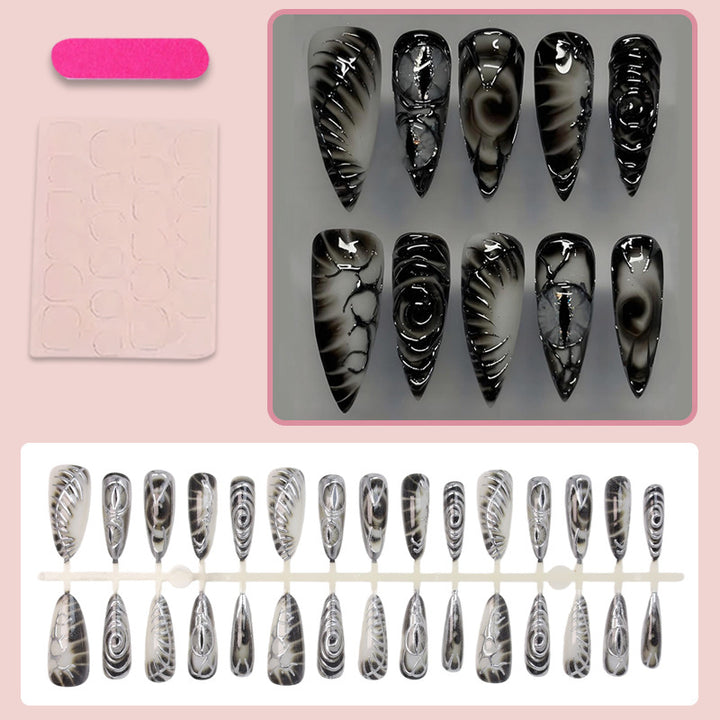 Artificial nail set with modern spiral pattern and shiny accents Stornfield