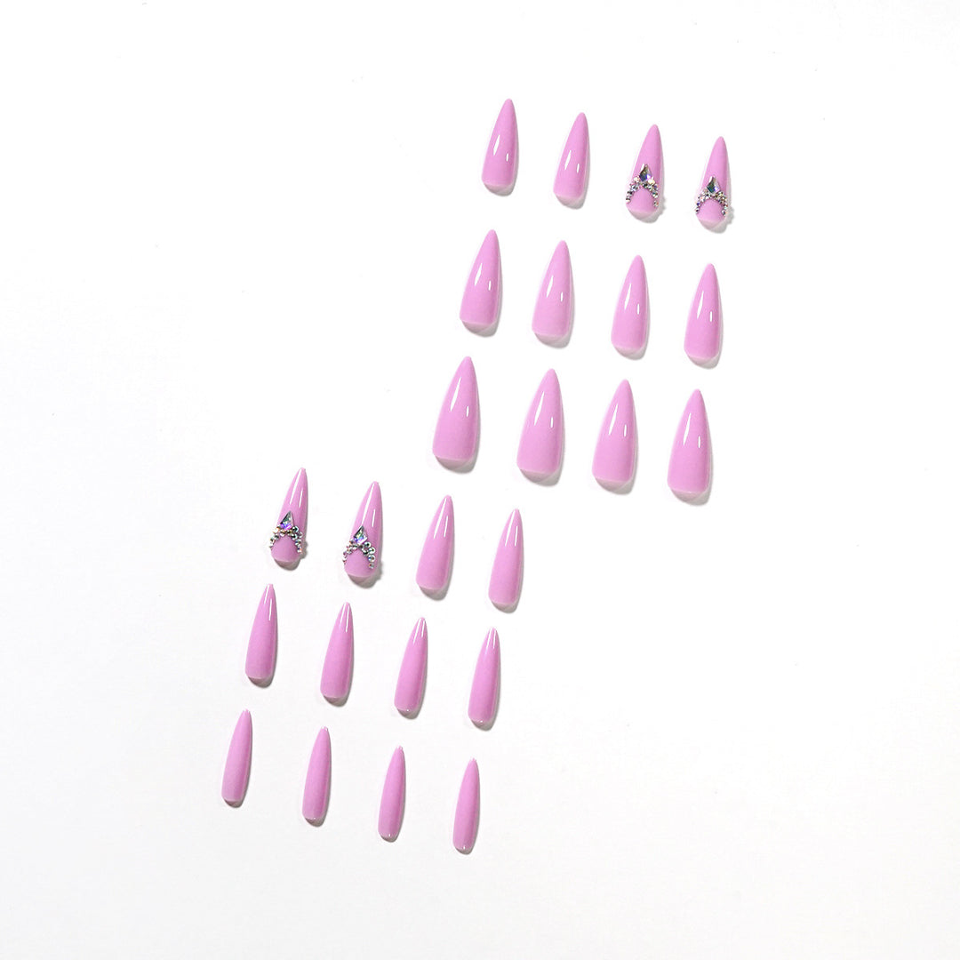 Glamorous stiletto nails with rhinestone decoration Stornfield