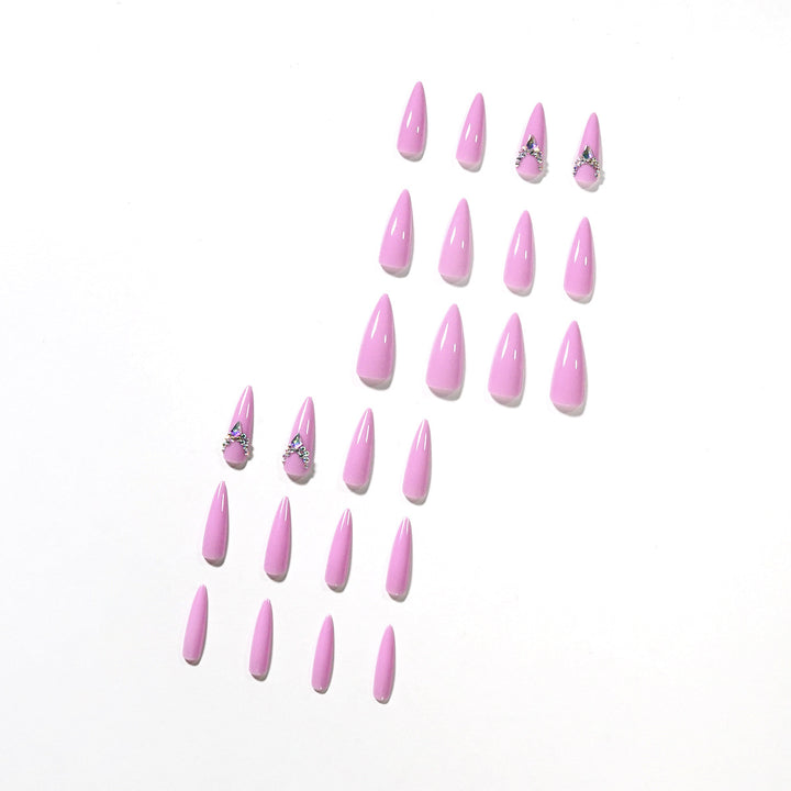 Glamorous stiletto nails with rhinestone decoration Stornfield