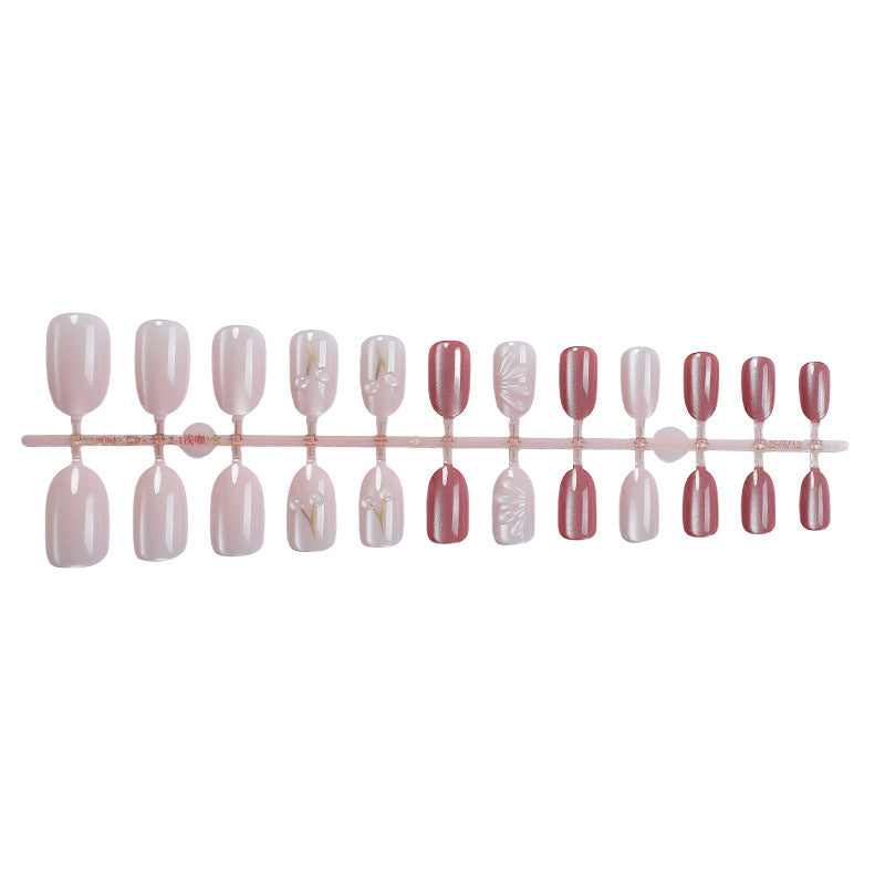 Acrylic nail set with elegant high-gloss finish and creative embellishments Stornfield