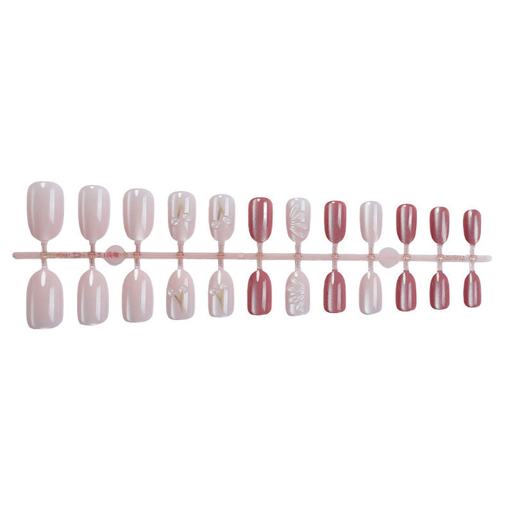 Acrylic nail set with elegant high-gloss finish and creative embellishments Stornfield