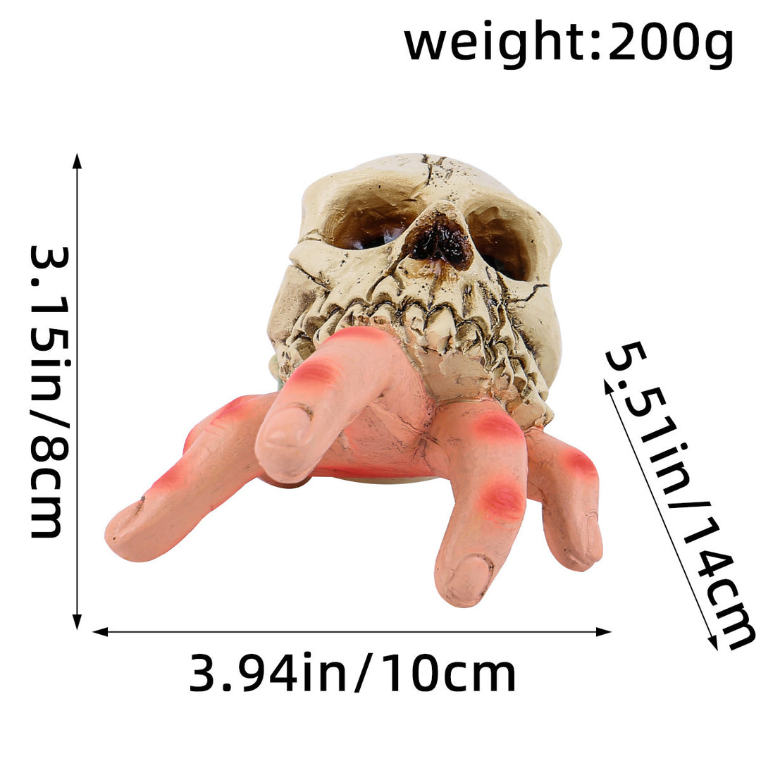 Detailed Halloween decoration sculpture skull with grasping hand