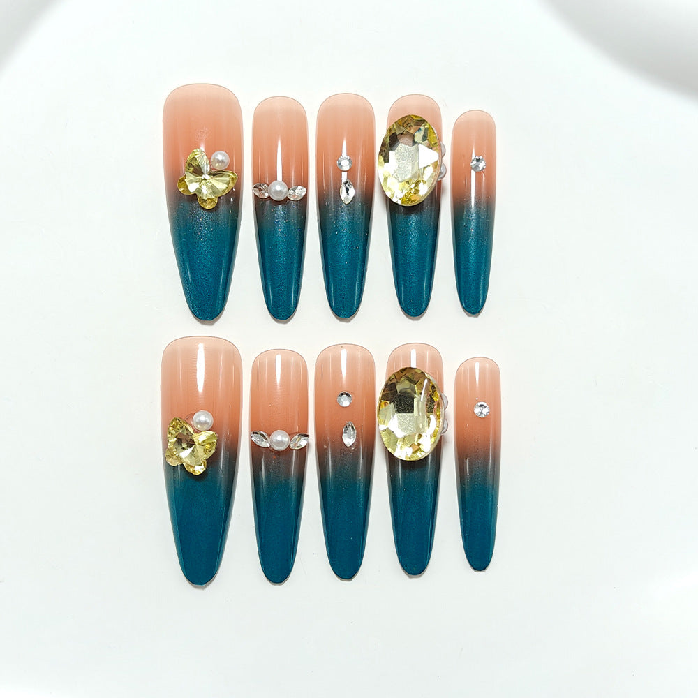 Glamorous artificial nails with elegant ombre effect and high-quality embellishments Stornfield