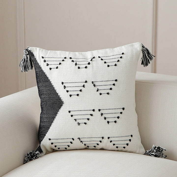 Decorative woven cushion cover with geometric tuft-relief and tassels Stornfield