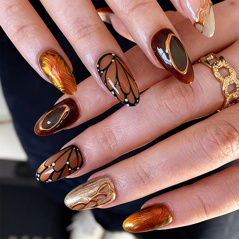 Artificial nail set with elegant gold and black design Stornfield