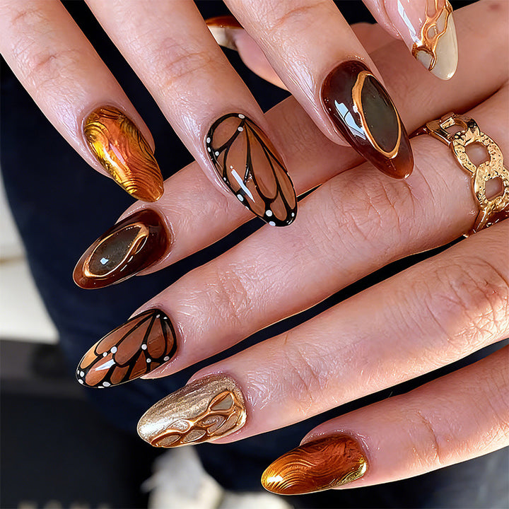 Artificial nail set with elegant gold and black design Stornfield