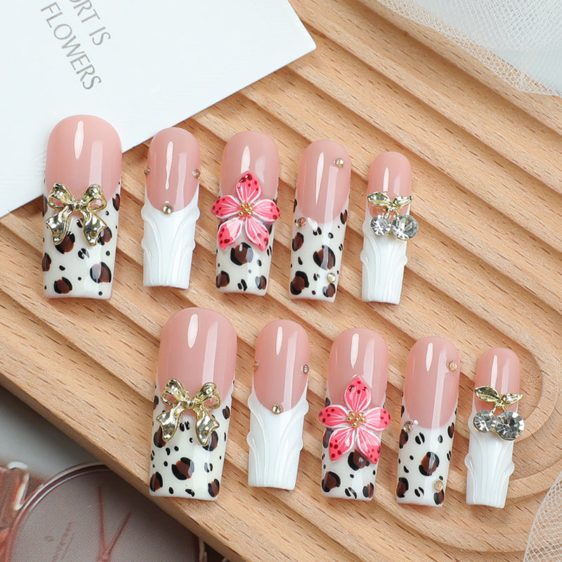 Acrylic nail set with elegant leopard design and floral accents Stornfield