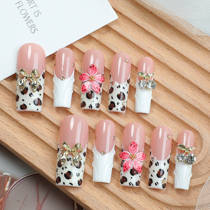 Acrylic nail set with elegant leopard design and floral accents Stornfield