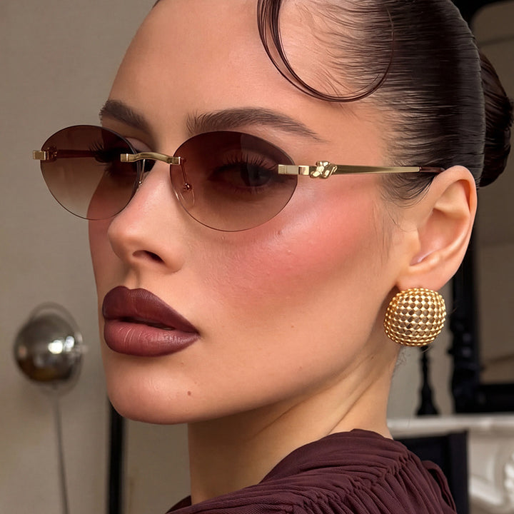 Women's elegant oval sunglasses with golden accents Stornfield