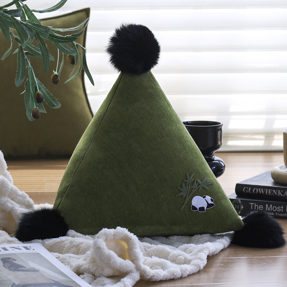 Decorative pillow in pyramid shape with animal design