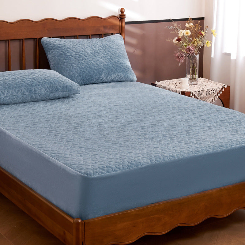 Quilted mattress protector with non-slip bottom and soft microfiber cover