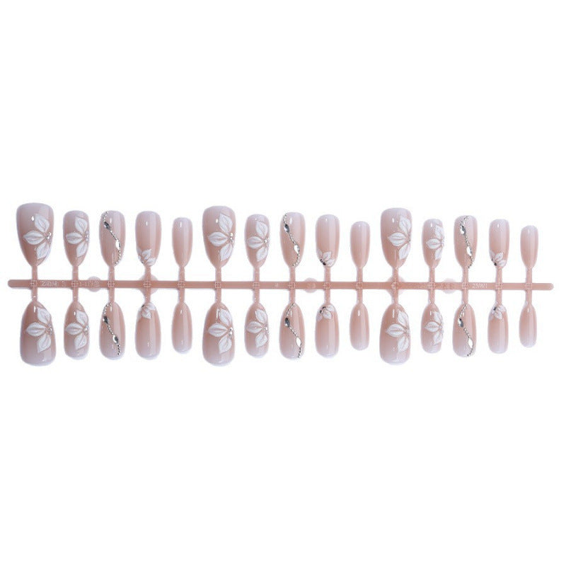 Artificial nail set with elegant flower designs and shimmering accents Stornfield