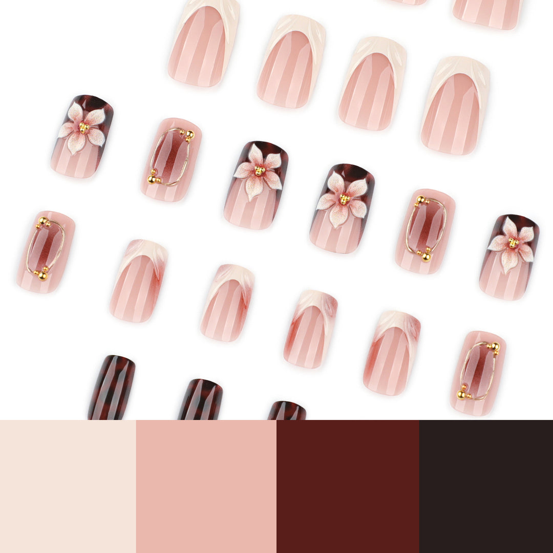 Artistic stiletto nails with elegant floral design and glitter effects Stornfield