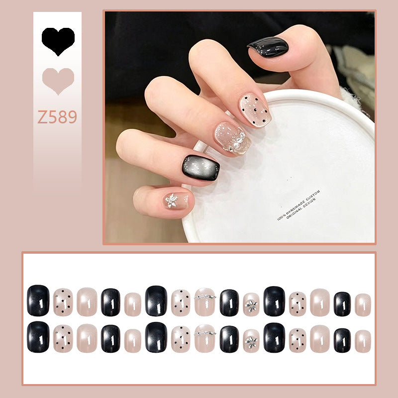 Acrylic nail set with glamorous accents and delicate designs Stornfield