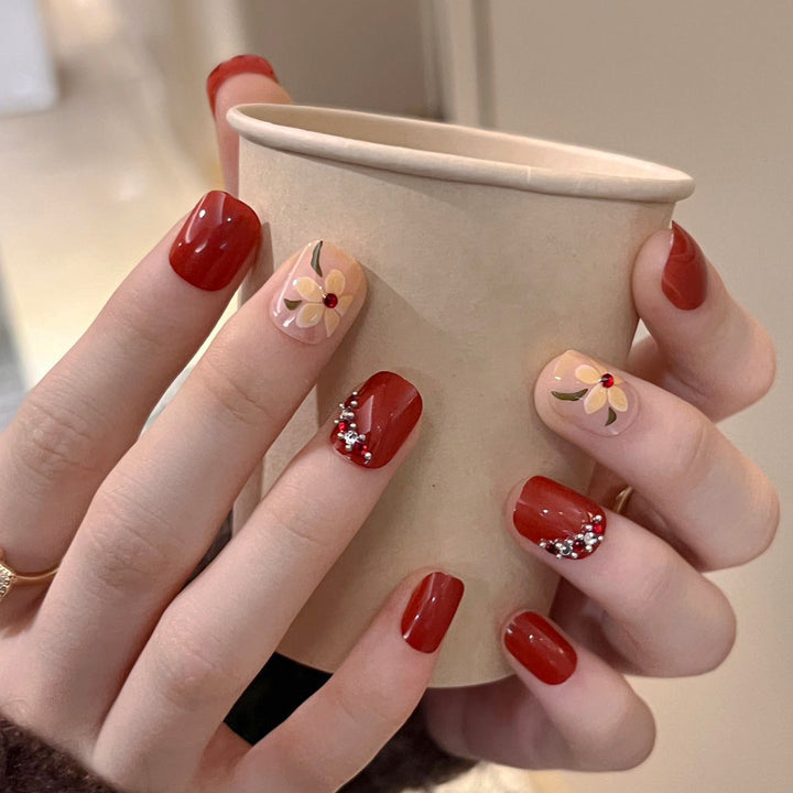 Artful nail extensions with an elegant leaf pattern Stornfield