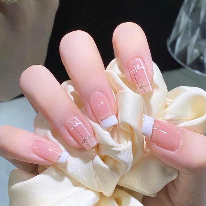 Nail set with elegant French tip and fashionable embellishments Stornfield