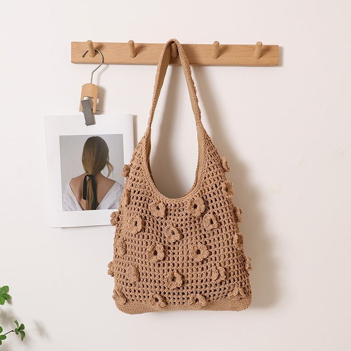 Hand-knotted shoulder bag with floral structural elements Stornfield