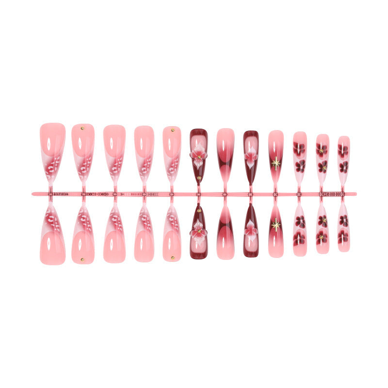 Artifical nail set with delicate floral design and glamorous accents Stornfield