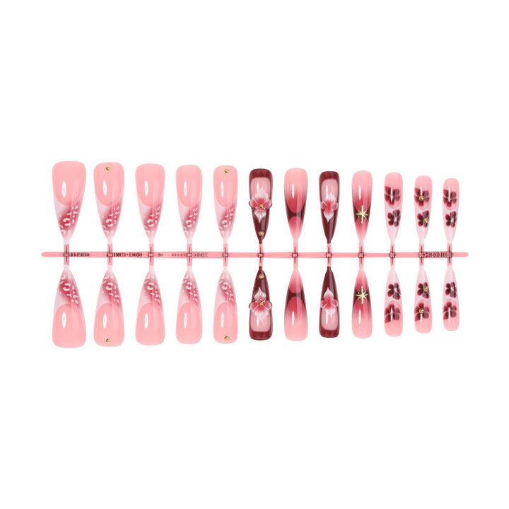 Artifical nail set with delicate floral design and glamorous accents Stornfield