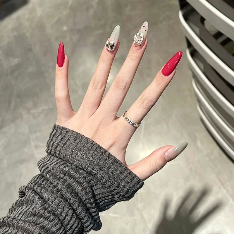 Artificial nail set with sparkling crystal accents and elegant color gradients Stornfield