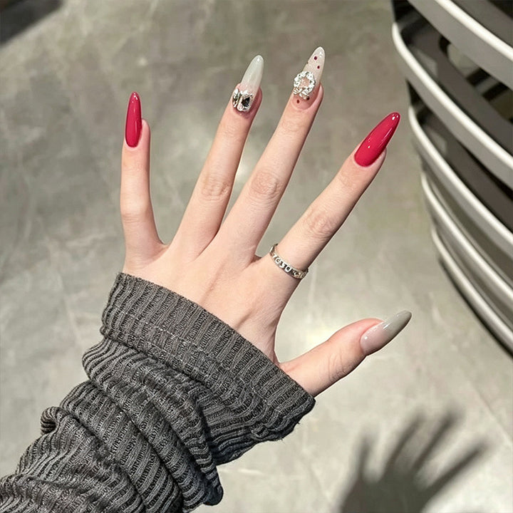 Artificial nail set with sparkling crystal accents and elegant color gradients Stornfield