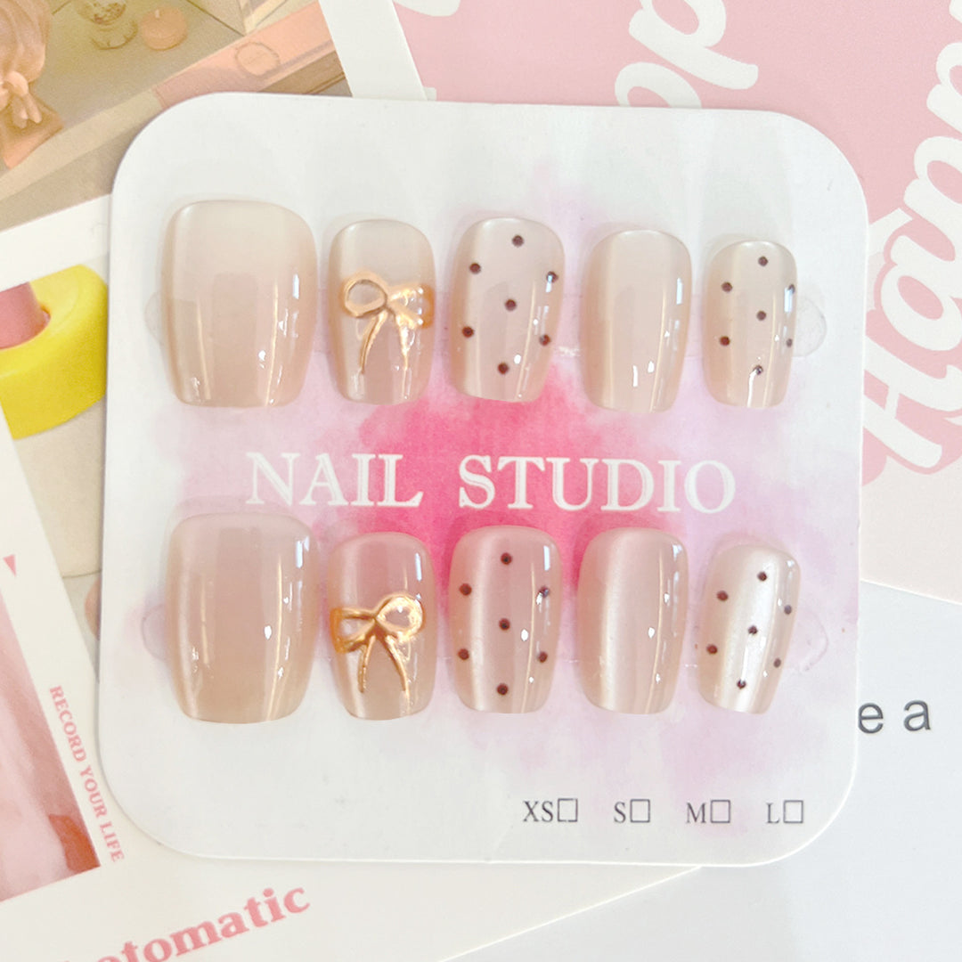 Artificial nail tips with elegant bow designs Stornfield