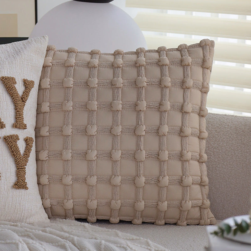 Square decorative cushion cover made of mottled bouclé weave with subtle piping Stornfield