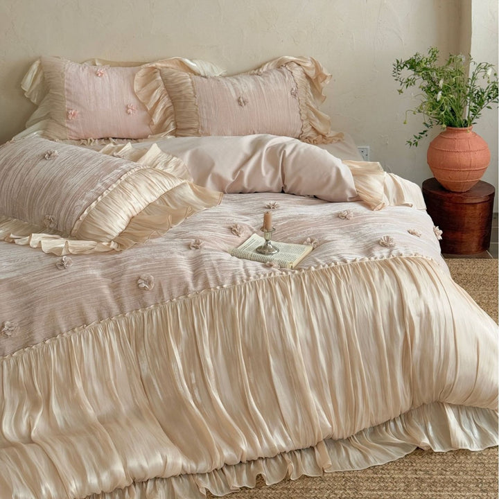 Satin look quilted bedspread with pleated ruffle and 3D flower appliqué