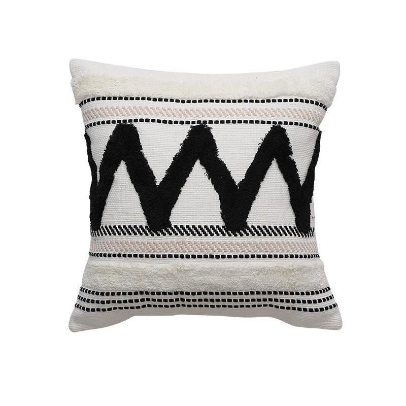 Decorative cotton cushion with pompom and woven ethnic relief