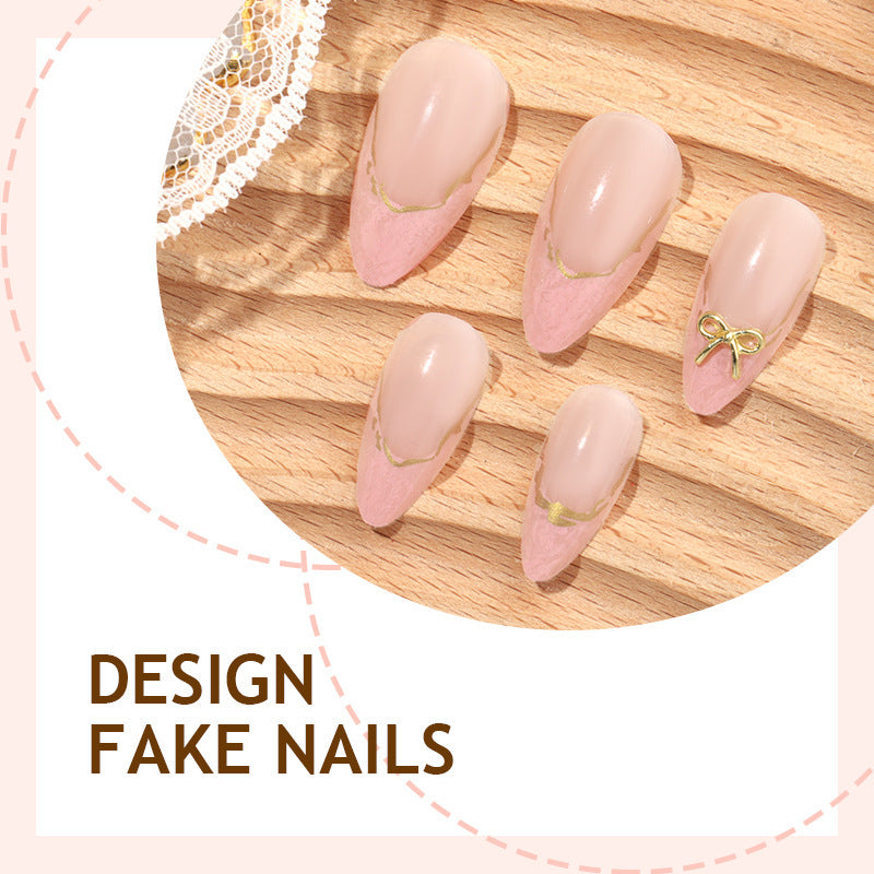 Artificial nail set with delicate bows and golden accents Stornfield