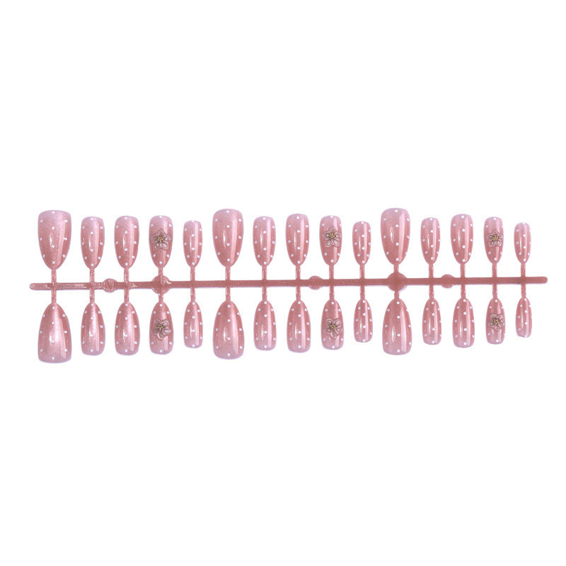 Artificial nail set with glitter and delicate floral and rhinestone embellishments Stornfield