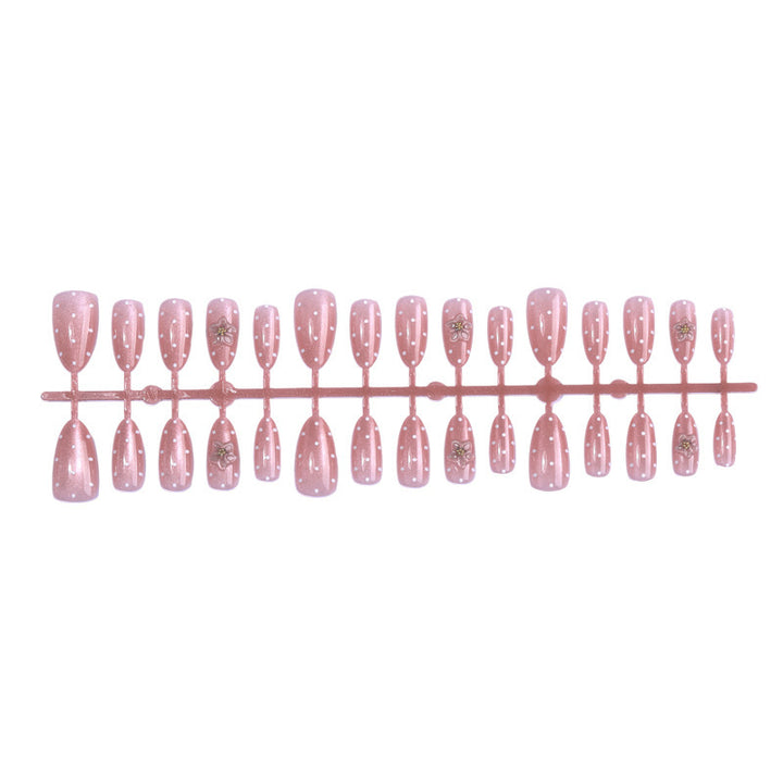 Artificial nail set with glitter and delicate floral and rhinestone embellishments Stornfield